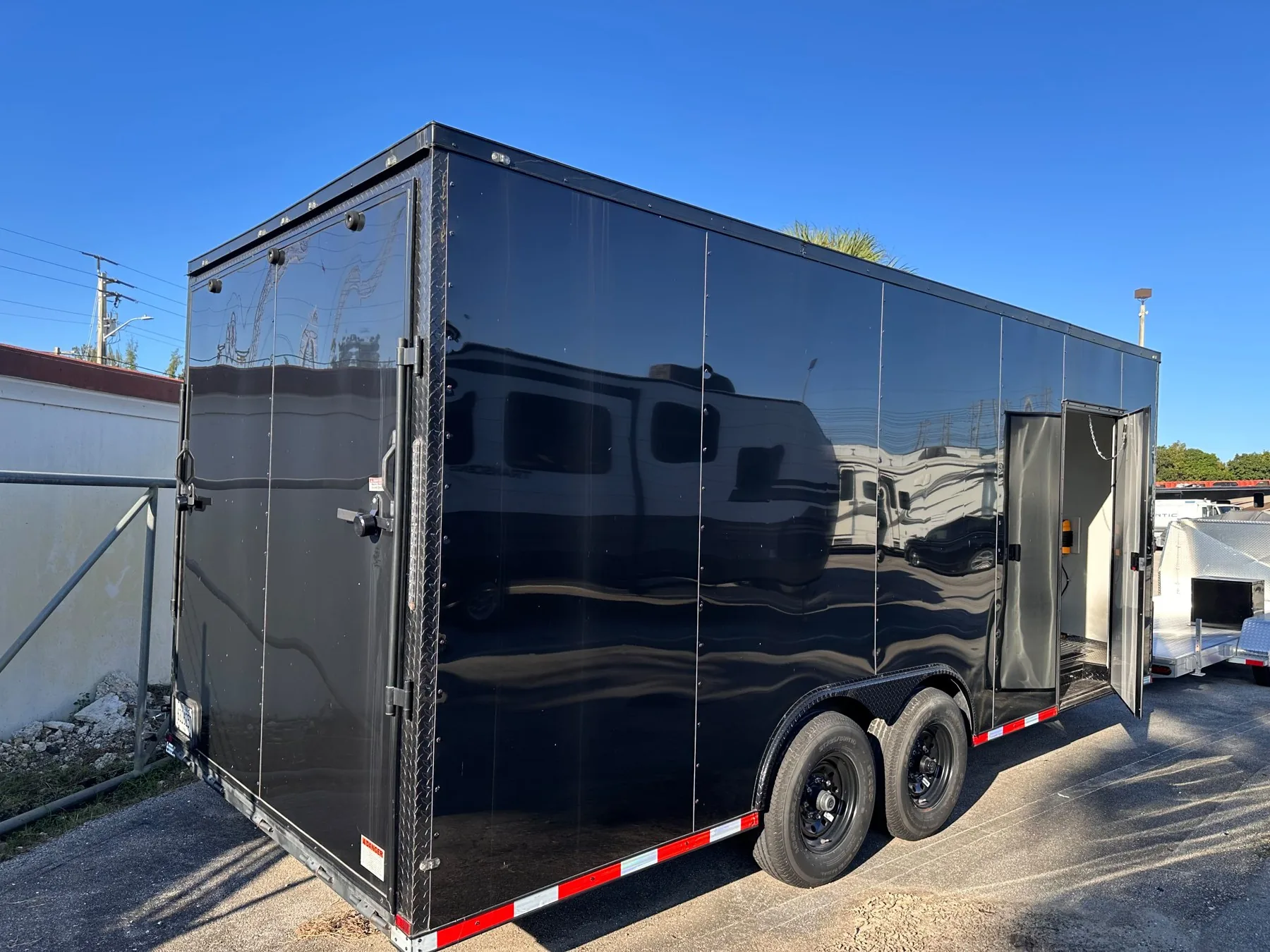 Black 8.5x20 enclosed car hauler trailer for rent in Miami, FL