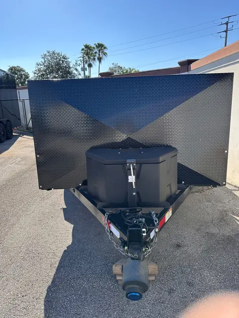 Front view of the motorcycle trailer with tool box