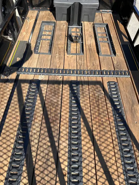 Deck e-track and wheel bases on the motorcycle trailer